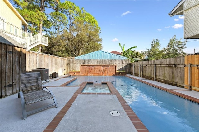 view of swimming pool with a patio, a fenced backyard, and cooling unit
