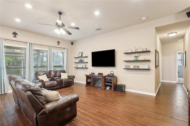living area with baseboards, recessed lighting, dark wood-style floors, visible vents, and ceiling fan