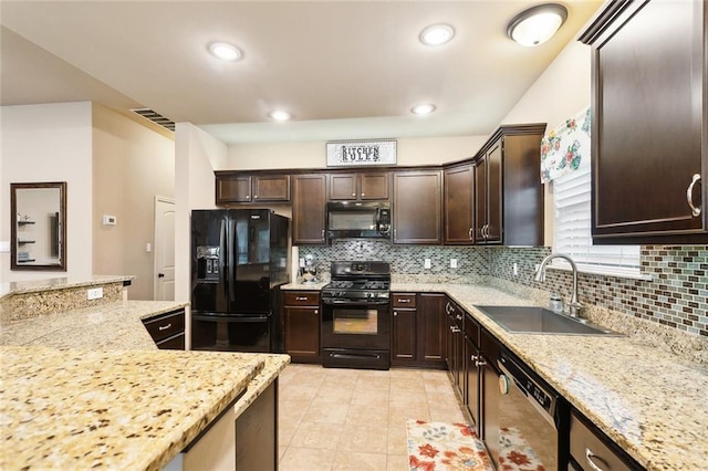 kitchen with dark brown cabinetry, a sink, black appliances, and decorative backsplash
