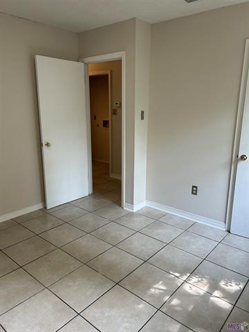 unfurnished bedroom featuring light tile patterned floors