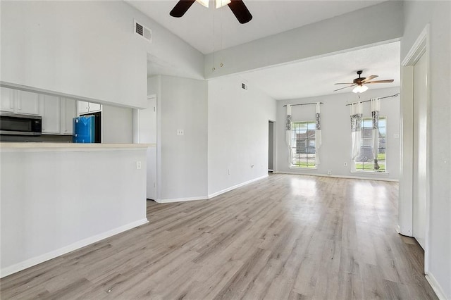 unfurnished living room with light wood finished floors, ceiling fan, and visible vents