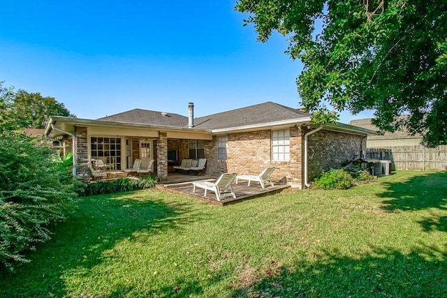 624 Fleurie Dr, Kenner, LA 70065 - back of property with brick siding, fence, a lawn, and central air condition unit