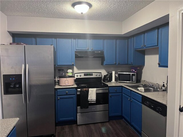 1921 Cartier Dr, La Place, LA 70068 - kitchen featuring under cabinet range hood, blue cabinetry, appliances with stainless steel finishes, and a sink