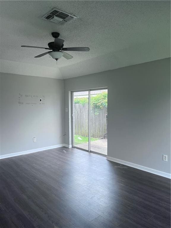 1921 Cartier Dr, La Place, LA 70068 - spare room featuring visible vents, baseboards, ceiling fan, and dark wood-style floors