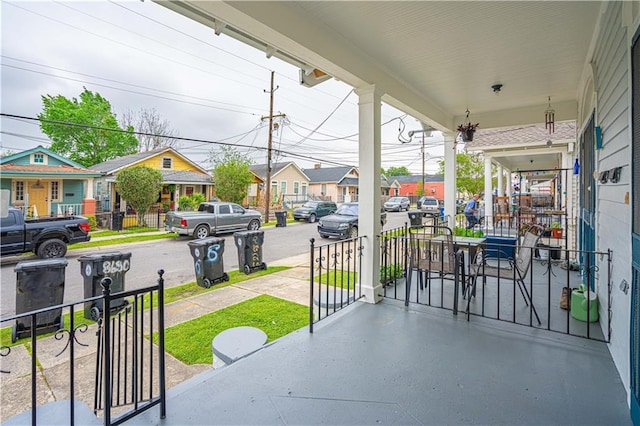 view of patio featuring a residential view and covered porch
