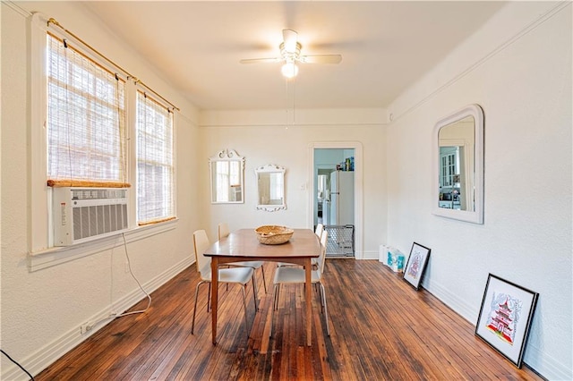 dining room with baseboards, ceiling fan, and wood-type flooring