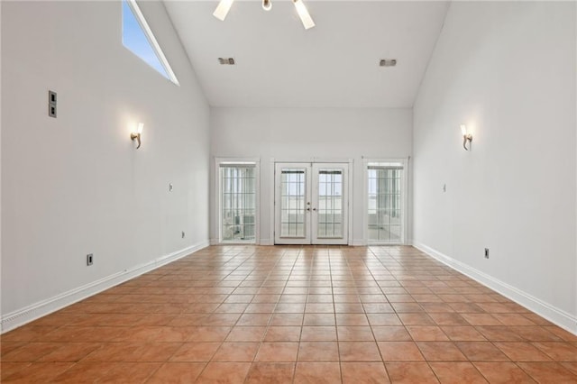 1091 Marina Dr, Slidell, LA 70458 - spare room with french doors, light tile patterned floors, baseboards, and a wealth of natural light