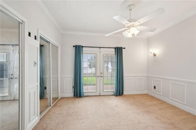 1091 Marina Dr, Slidell, LA 70458 - unfurnished bedroom with crown molding, french doors, access to outside, and light colored carpet