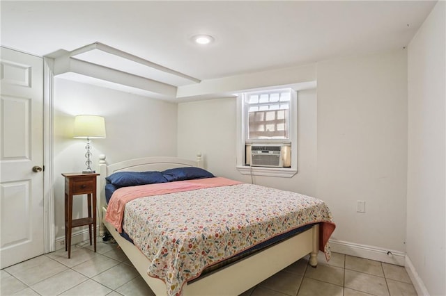 2227 Wirth Pl, New Orleans, LA 70115 - bedroom featuring cooling unit, baseboards, and light tile patterned flooring
