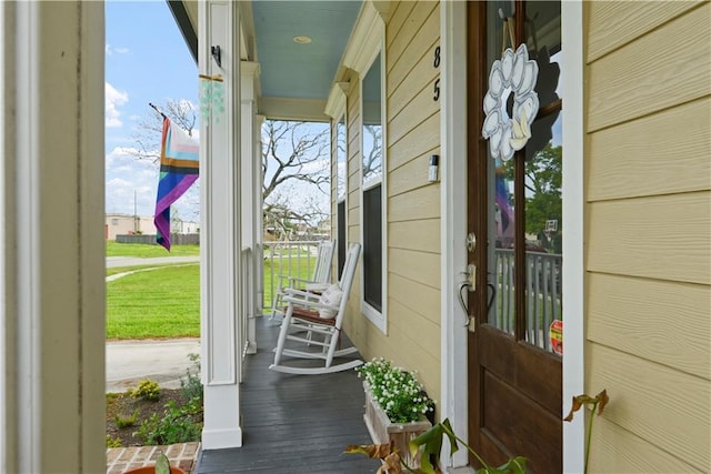 85 W Claiborne Sq, Chalmette, LA 70043 - property entrance featuring covered porch and a lawn