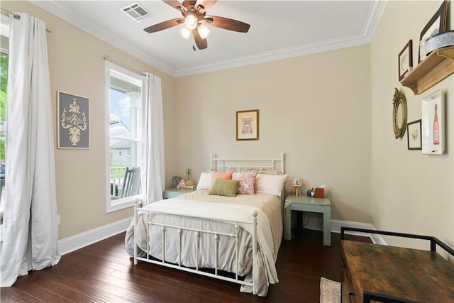85 W Claiborne Sq, Chalmette, LA 70043 - bedroom with visible vents, baseboards, crown molding, and wood finished floors