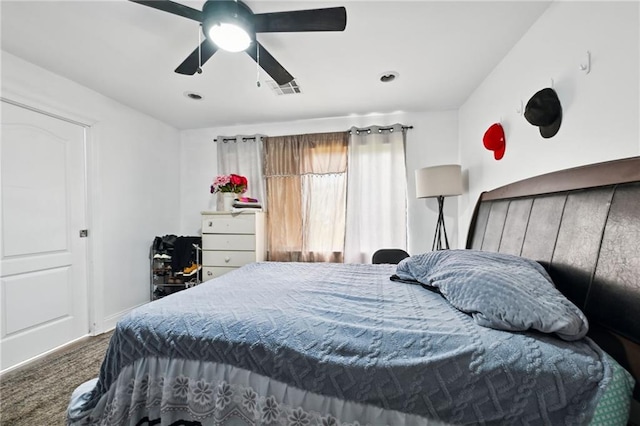 carpeted bedroom with baseboards and ceiling fan