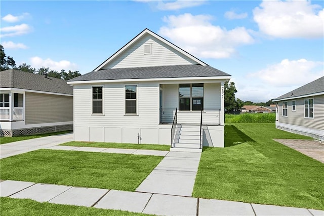 7821 Parry St, New Orleans, LA 70128 - view of front of home with a porch, roof with shingles, and a front yard