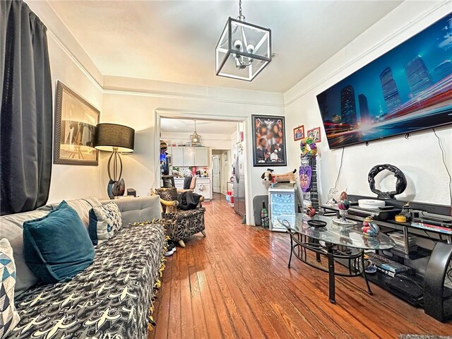 165355 Treasure St, New Orleans, LA 70119 - living room featuring hardwood / wood-style floors, a chandelier, and ornamental molding