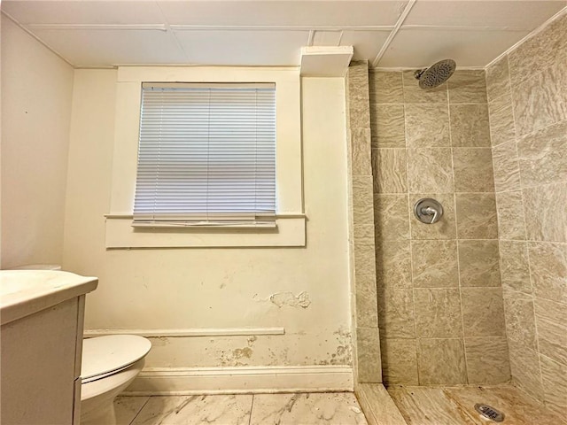 165355 Treasure St, New Orleans, LA 70119 - bathroom with baseboards, toilet, a tile shower, and vanity