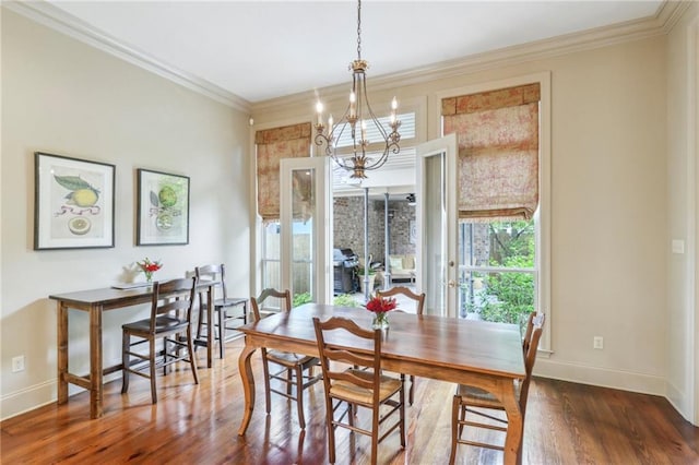 519 Homestead Ave, Metairie, LA 70005 - dining room with ornamental molding, baseboards, an inviting chandelier, and wood finished floors