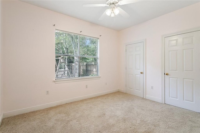 unfurnished bedroom with baseboards, ceiling fan, and carpet flooring