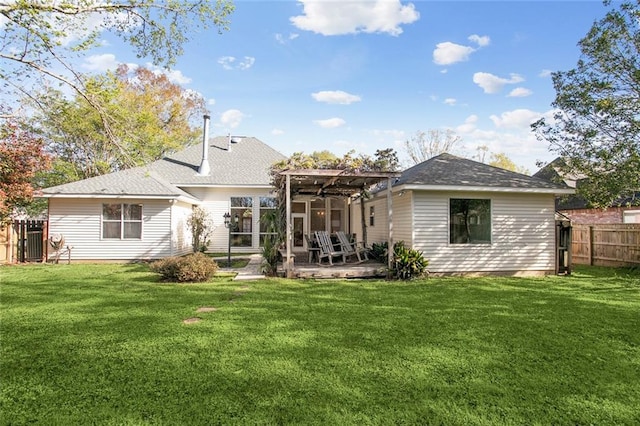 back of house featuring a patio, fence, a yard, and a pergola