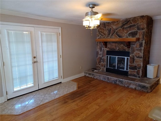 unfurnished living room featuring crown molding, french doors, and wood finished floors
