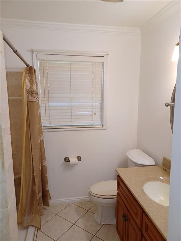 bathroom featuring crown molding, vanity, a shower with curtain, toilet, and tile patterned floors