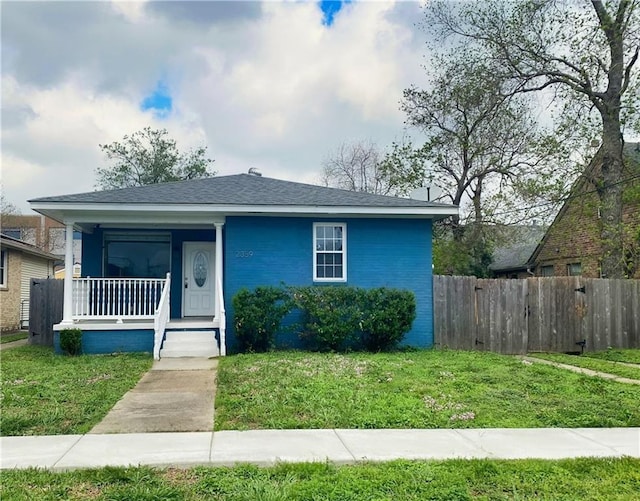 2359 Prentiss Ave, New Orleans, LA 70122 - bungalow-style home featuring a front yard, fence, and covered porch