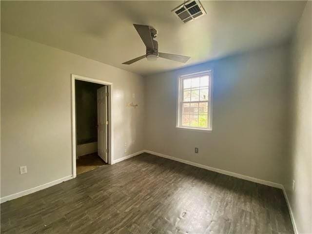 2359 Prentiss Ave, New Orleans, LA 70122 - unfurnished bedroom with dark wood-style flooring, visible vents, baseboards, and ceiling fan