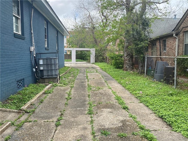 2359 Prentiss Ave, New Orleans, LA 70122 - view of yard with central AC unit, a vegetable garden, and fence