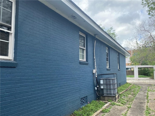 2359 Prentiss Ave, New Orleans, LA 70122 - view of property exterior with brick siding, crawl space, and cooling unit