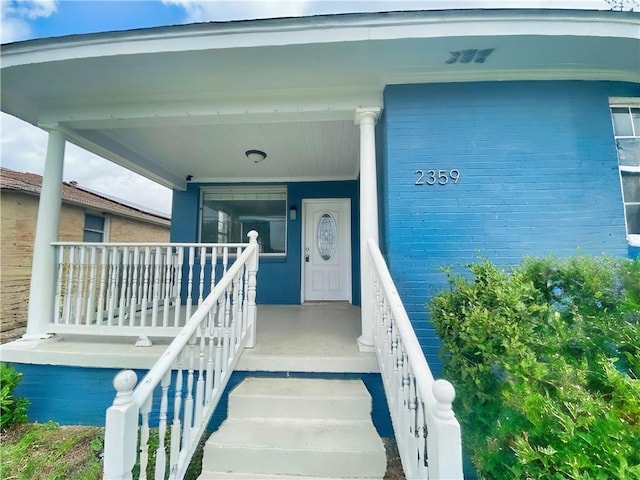2359 Prentiss Ave, New Orleans, LA 70122 - doorway to property featuring a porch