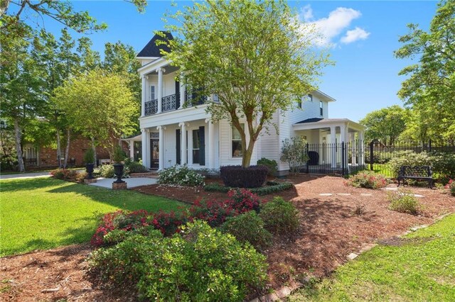 3752 Lake Charles Dr, Gretna, LA 70056 - neoclassical / greek revival house with a front yard and a balcony
