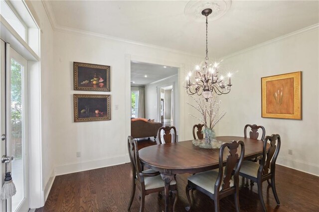 3752 Lake Charles Dr, Gretna, LA 70056 - dining room featuring a wealth of natural light, dark wood-style floors, baseboards, and crown molding