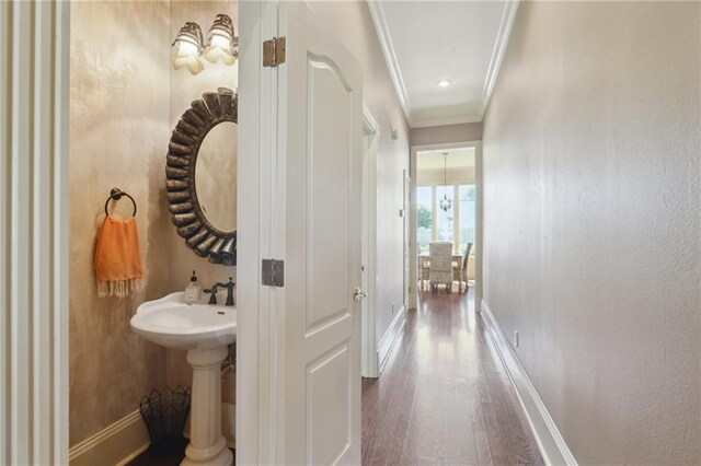 3752 Lake Charles Dr, Gretna, LA 70056 - half bath with baseboards, crown molding, and wood finished floors