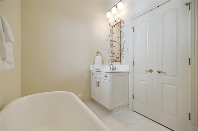 3752 Lake Charles Dr, Gretna, LA 70056 - bathroom featuring tile patterned flooring, vanity, and a soaking tub