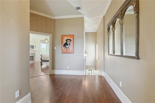 3752 Lake Charles Dr, Gretna, LA 70056 - hall featuring visible vents, baseboards, ornamental molding, and wood finished floors