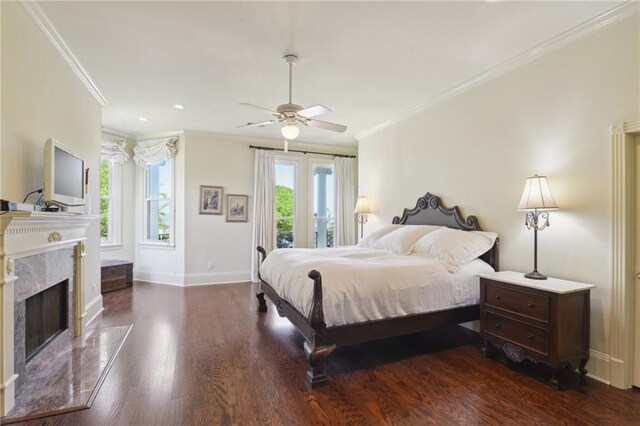 3752 Lake Charles Dr, Gretna, LA 70056 - bedroom featuring access to outside, baseboards, ornamental molding, a fireplace, and wood finished floors