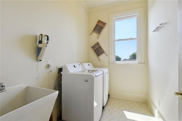 3752 Lake Charles Dr, Gretna, LA 70056 - washroom featuring washer and clothes dryer, plenty of natural light, laundry area, and a sink