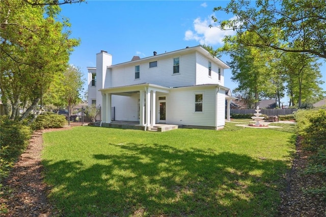 3752 Lake Charles Dr, Gretna, LA 70056 - rear view of property featuring a yard and fence