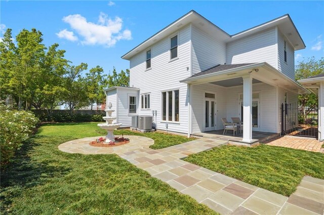 3752 Lake Charles Dr, Gretna, LA 70056 - rear view of property with a yard, a patio area, fence, and central AC