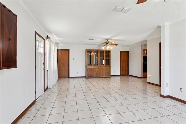 unfurnished living room with visible vents, crown molding, and ceiling fan