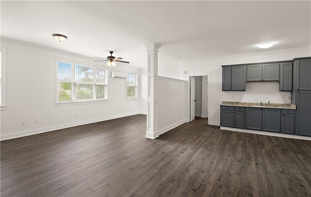 unfurnished living room with crown molding, a wall mounted AC, ceiling fan, and dark wood-style flooring