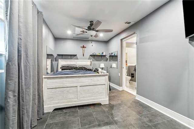 2101 Congressman Hebert Dr, Chalmette, LA 70043 - bedroom with ceiling fan, baseboards, visible vents, and connected bathroom