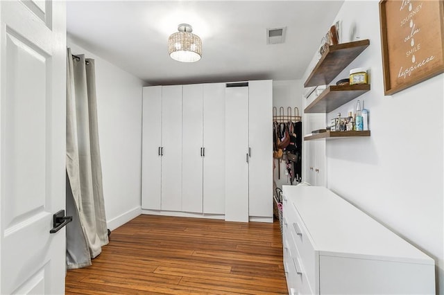 mudroom featuring visible vents and wood finished floors