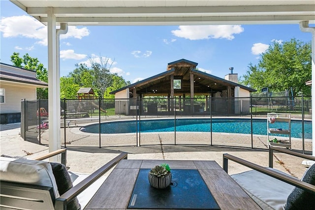 view of pool with a patio, a gazebo, a fenced in pool, and fence