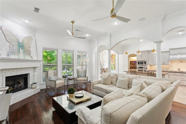 809 S Corniche Du Lac, Covington, LA 70433 - living area featuring ceiling fan, ornate columns, ornamental molding, a brick fireplace, and recessed lighting