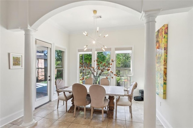 809 S Corniche Du Lac, Covington, LA 70433 - dining space featuring decorative columns, arched walkways, light tile patterned floors, ornamental molding, and a chandelier