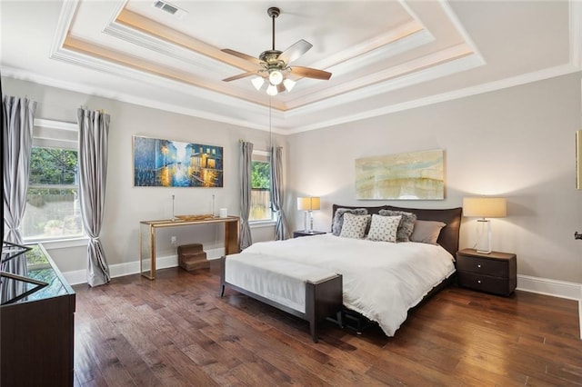 809 S Corniche Du Lac, Covington, LA 70433 - bedroom featuring a raised ceiling, crown molding, wood-type flooring, and ceiling fan