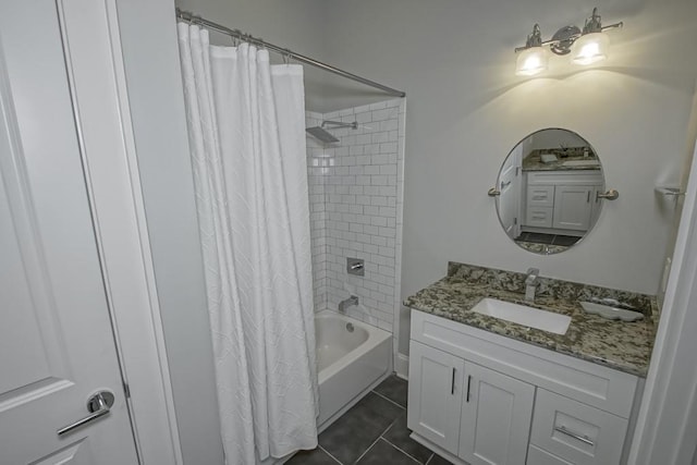 bathroom featuring tile patterned floors, shower / bathtub combination with curtain, and vanity