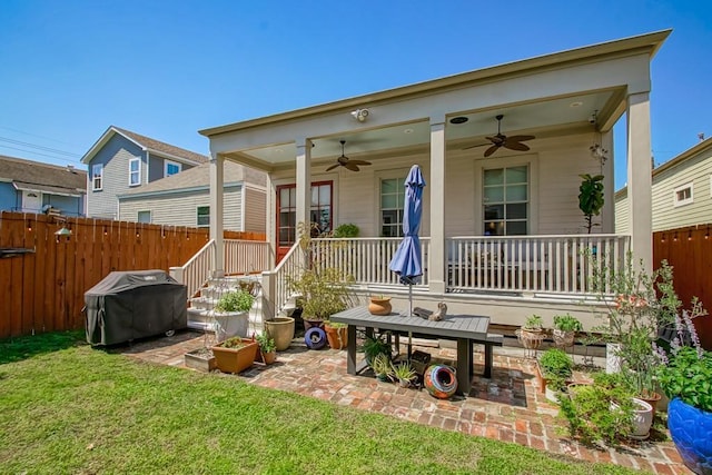 back of property with a patio, fence, and ceiling fan