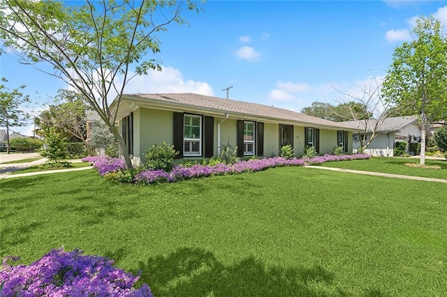 3000 Clifford Dr, Metairie, LA 70002 - single story home featuring brick siding and a front lawn