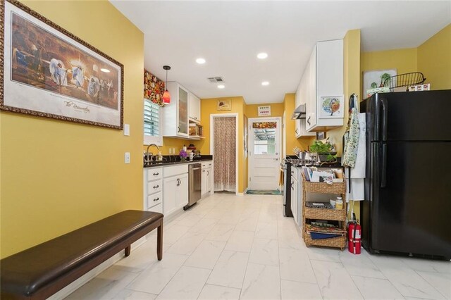 3000 Clifford Dr, Metairie, LA 70002 - kitchen with white cabinets, a sink, dark countertops, stainless steel appliances, and marble finish floor